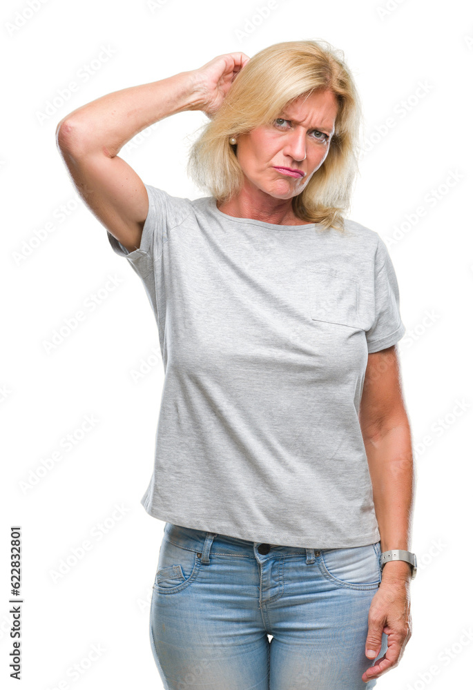 Fototapeta premium Middle age blonde woman over isolated background confuse and wonder about question. Uncertain with doubt, thinking with hand on head. Pensive concept.