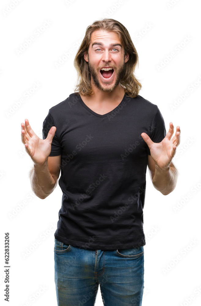 Young handsome man with long hair over isolated background celebrating crazy and amazed for success with arms raised and open eyes screaming excited. Winner concept Young handsome man with long hair over isolated background celebrating crazy and amazed for success with arms raised and open eyes screaming excited. Winner concept