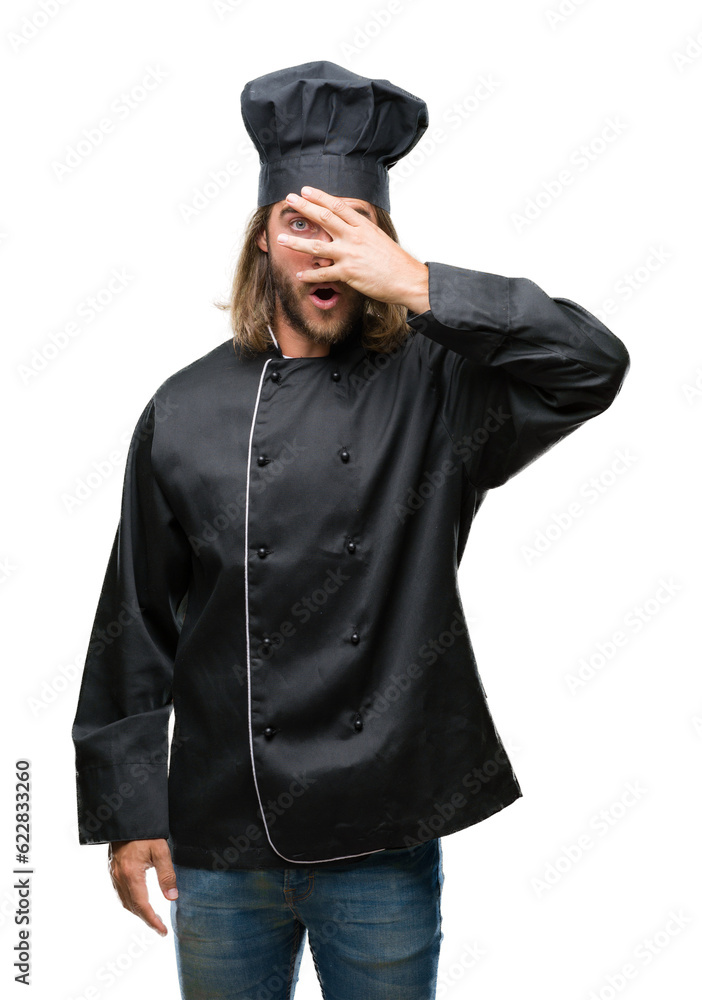 Young handsome cook man with long hair over isolated background peeking in shock covering face and eyes with hand, looking through fingers with embarrassed expression. Young handsome cook man with long hair over isolated background peeking in shock covering face and eyes with hand, looking through fingers with embarrassed expression.