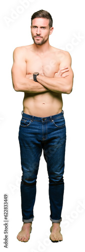 Handsome shirtless man showing nude chest skeptic and nervous, disapproving expression on face with crossed arms. Negative person.