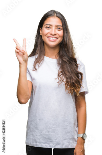 Young beautiful arab woman over isolated background showing and pointing up with fingers number two while smiling confident and happy.