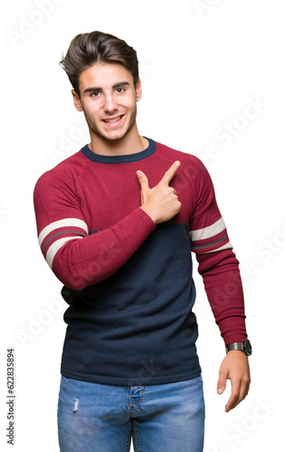 Young handsome man over isolated background cheerful with a smile of face pointing with hand and finger up to the side with happy and natural expression on face