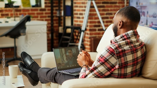 Tablou pe pânză Prospecting job candidate answering human resources interview questions during online video call while staying at home