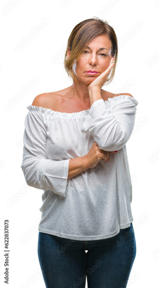 Middle age senior hispanic woman over isolated background thinking looking tired and bored with depression problems with crossed arms. Middle age senior hispanic woman over isolated background thinking looking tired and bored with depression problems with crossed arms.