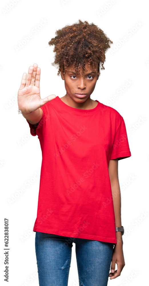 Beautiful young african american woman over isolated background doing stop sing with palm of the hand. Warning expression with negative and serious gesture on the face. Beautiful young african american woman over isolated background doing stop sing with palm of the hand. Warning expression with negative and serious gesture on the face.