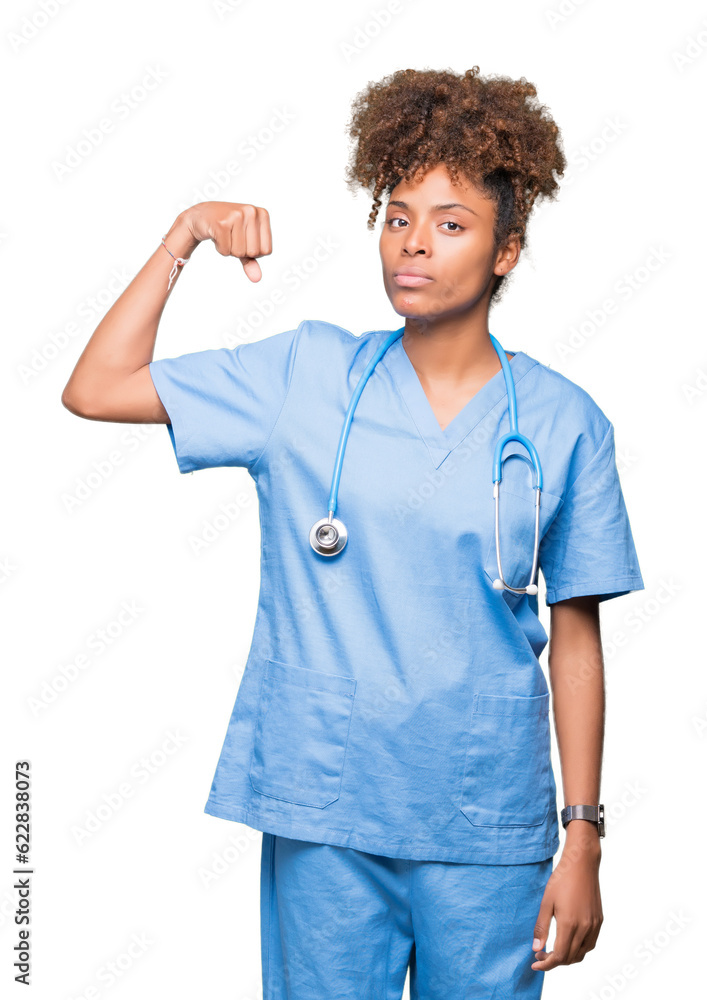 Young african american doctor woman over isolated background Strong person showing arm muscle, confident and proud of power Young african american doctor woman over isolated background Strong person showing arm muscle, confident and proud of power