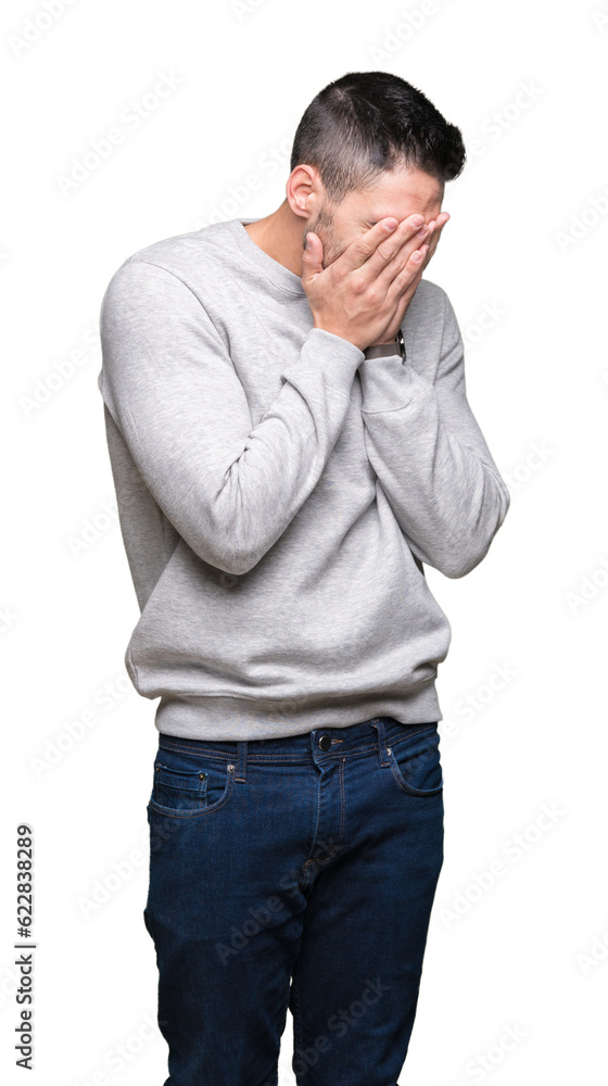 Young handsome man wearing sweatshirt over isolated background with sad expression covering face with hands while crying. Depression concept. Young handsome man wearing sweatshirt over isolated background with sad expression covering face with hands while crying. Depression concept.