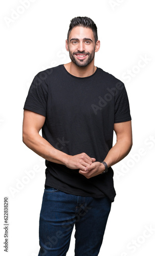 Young handsome man over isolated background Hands together and fingers crossed smiling relaxed and cheerful. Success and optimistic