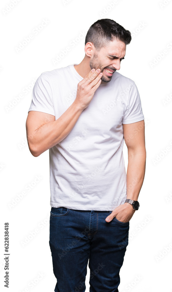 Young man wearing casual white t-shirt over isolated background touching mouth with hand with painful expression because of toothache or dental illness on teeth. Dentist concept. Young man wearing casual white t-shirt over isolated background touching mouth with hand with painful expression because of toothache or dental illness on teeth. Dentist concept.