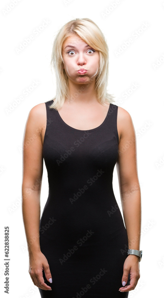 Young beautiful blonde attractive woman wearing elegant dress over isolated background puffing cheeks with funny face. Mouth inflated with air, crazy expression. Young beautiful blonde attractive woman wearing elegant dress over isolated background puffing cheeks with funny face. Mouth inflated with air, crazy expression.