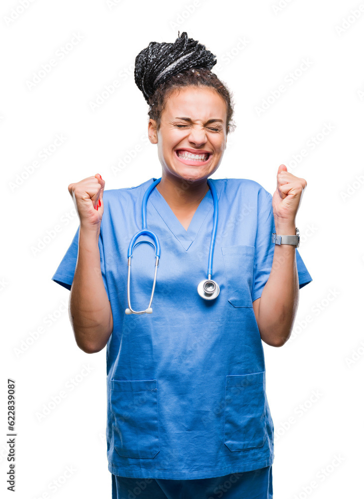 Young braided hair african american girl professional surgeon over isolated background excited for success with arms raised celebrating victory smiling. Winner concept. Young braided hair african american girl professional surgeon over isolated background excited for success with arms raised celebrating victory smiling. Winner concept.
