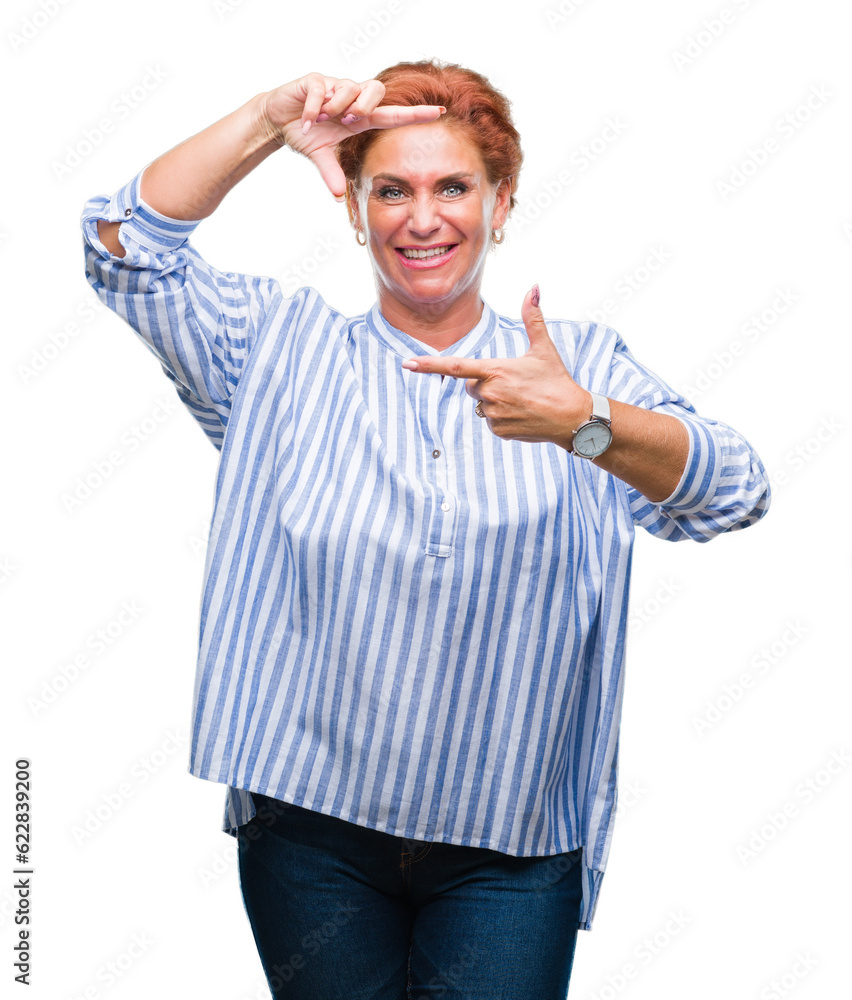 Atrractive senior caucasian redhead woman over isolated background smiling making frame with hands and fingers with happy face. Creativity and photography concept. Atrractive senior caucasian redhead woman over isolated background smiling making frame with hands and fingers with happy face. Creativity and photography concept.
