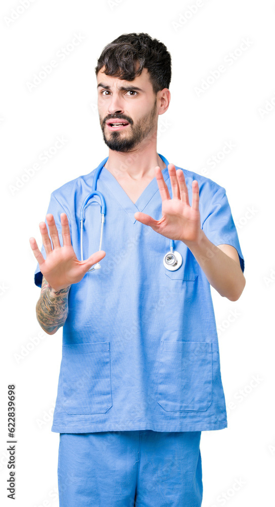Young handsome nurse man wearing surgeon uniform over isolated background afraid and terrified with fear expression stop gesture with hands, shouting in shock. Panic concept. Young handsome nurse man wearing surgeon uniform over isolated background afraid and terrified with fear expression stop gesture with hands, shouting in shock. Panic concept.