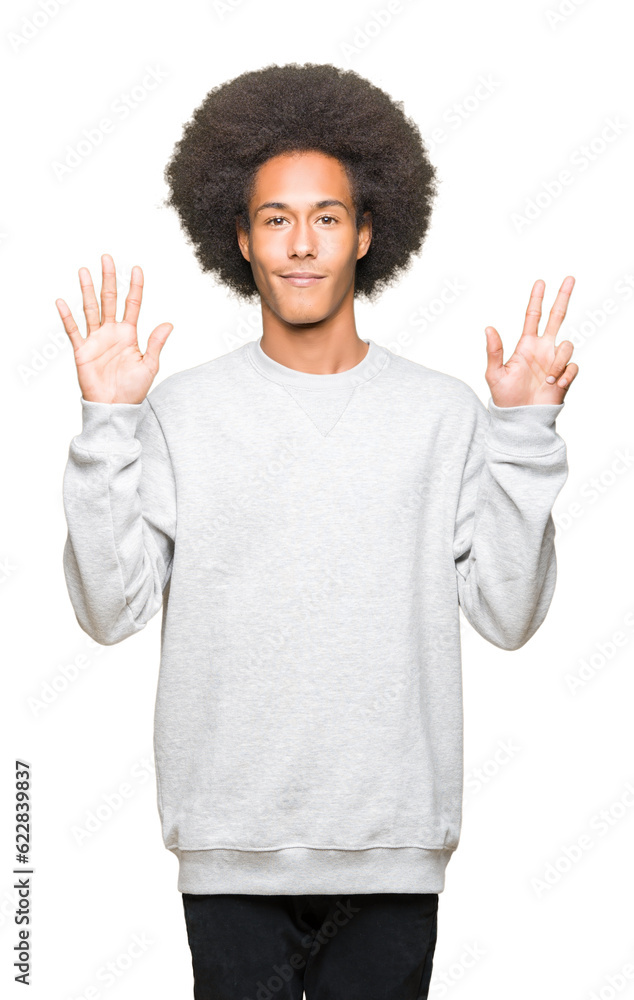 Young african american man with afro hair wearing sporty sweatshirt showing and pointing up with fingers number eight while smiling confident and happy. Young african american man with afro hair wearing sporty sweatshirt showing and pointing up with fingers number eight while smiling confident and happy.