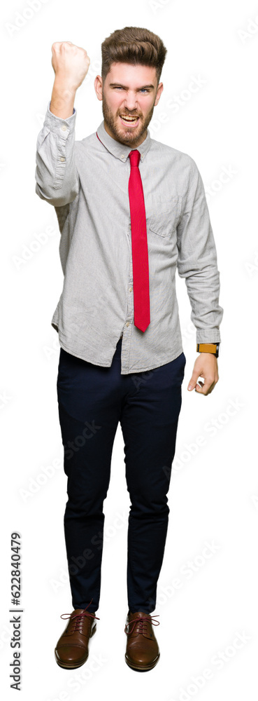 Young handsome business man angry and mad raising fist frustrated and furious while shouting with anger. Rage and aggressive concept. Young handsome business man angry and mad raising fist frustrated and furious while shouting with anger. Rage and aggressive concept.