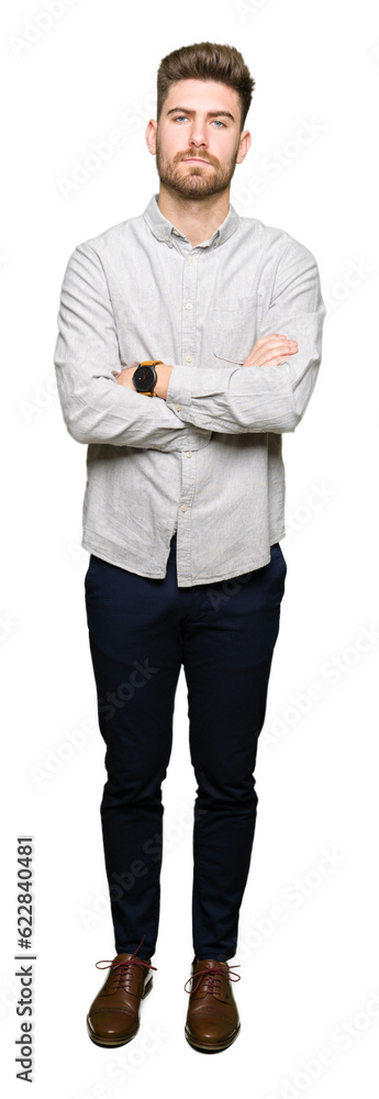 Young handsome man wearing casual shirt skeptic and nervous, disapproving expression on face with crossed arms. Negative person. Young handsome man wearing casual shirt skeptic and nervous, disapproving expression on face with crossed arms. Negative person.