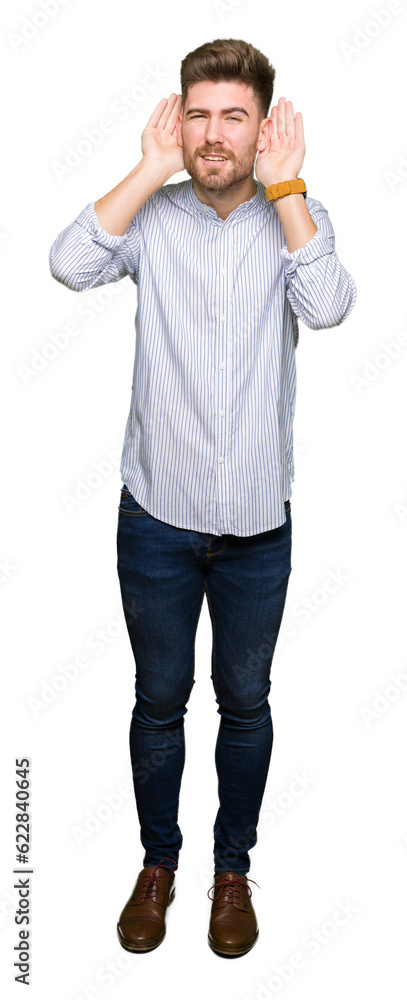 Young handsome man Trying to hear both hands on ear gesture, curious for gossip. Hearing problem, deaf Young handsome man Trying to hear both hands on ear gesture, curious for gossip. Hearing problem, deaf