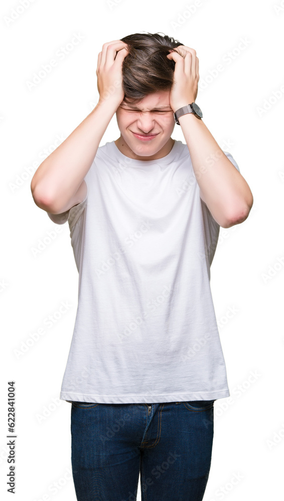 Young handsome man wearing casual white t-shirt over isolated background suffering from headache desperate and stressed because pain and migraine. Hands on head. Young handsome man wearing casual white t-shirt over isolated background suffering from headache desperate and stressed because pain and migraine. Hands on head.