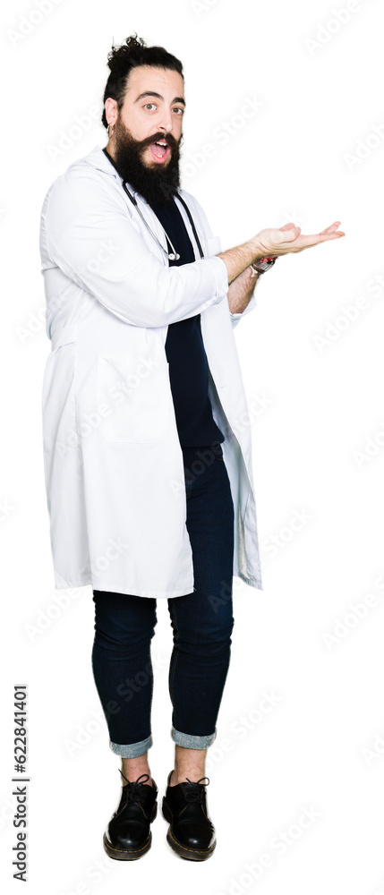 Doctor with long hair wearing medical coat and stethoscope Pointing to the side with hand and open palm, presenting ad smiling happy and confident Doctor with long hair wearing medical coat and stethoscope Pointing to the side with hand and open palm, presenting ad smiling happy and confident