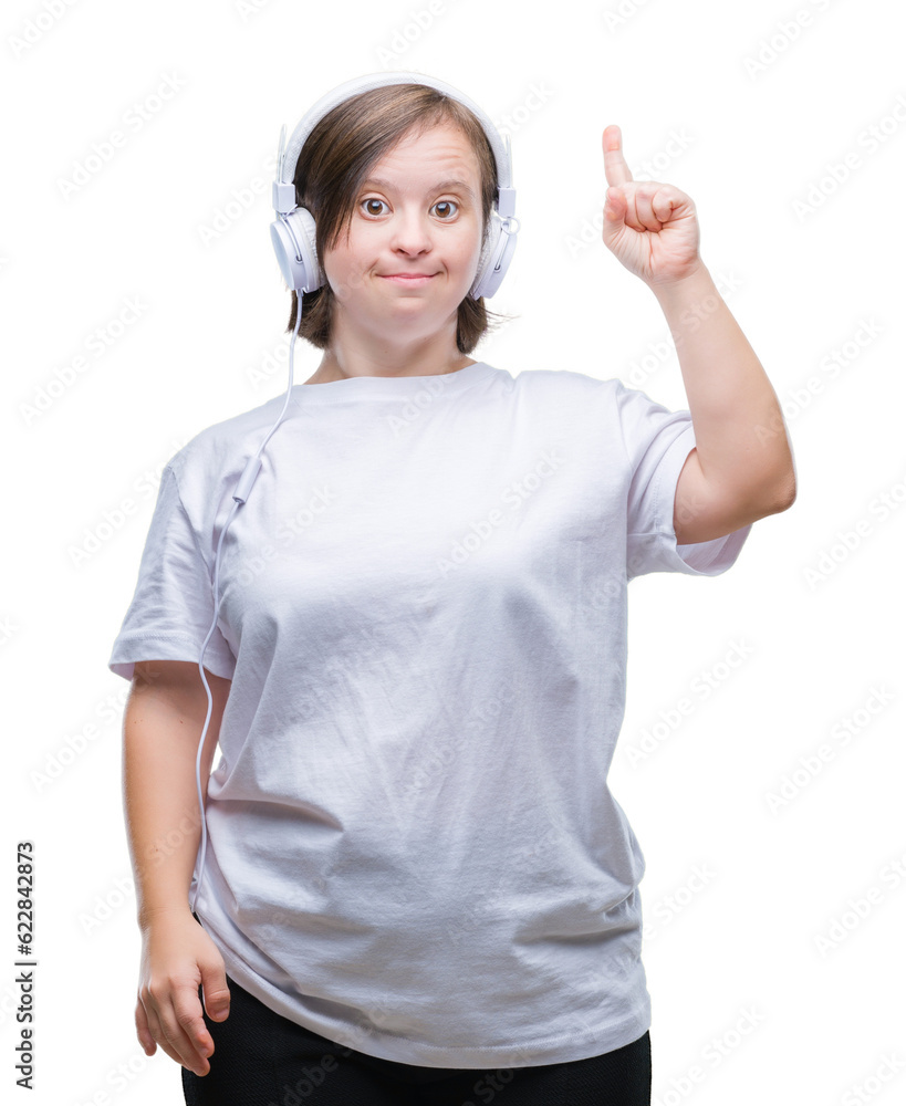 Young adult woman with down syndrome wearing headphones over isolated background pointing finger up with successful idea. Exited and happy. Number one.