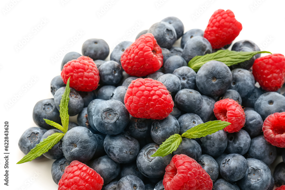 Ripe raspberry and blueberry on white background, closeup Ripe raspberry and blueberry on white background, closeup