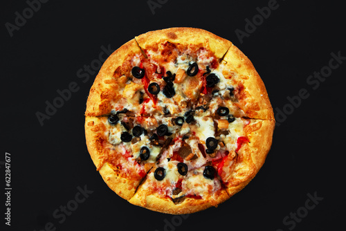 Fresh pizza with olives on a black background.