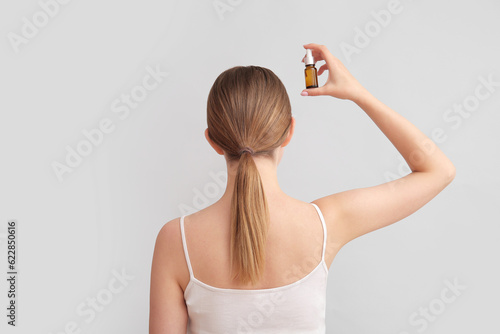 Young woman with cosmetic o...