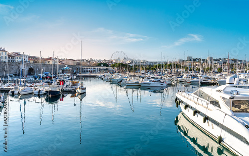 Murais de parede Yachts and sailboats moored in Antibes marina on a blue water - French Riviera, Cote D Azur, France - Summer vacation concept