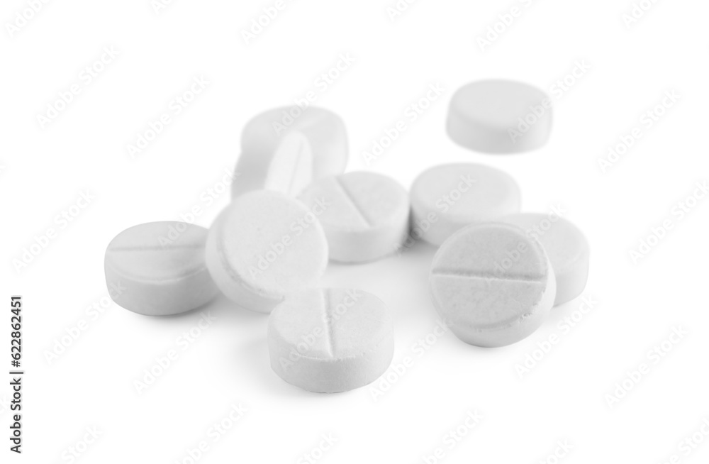 Pile of round pills on white background