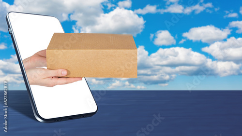 Cardboard box in hand. Parc...