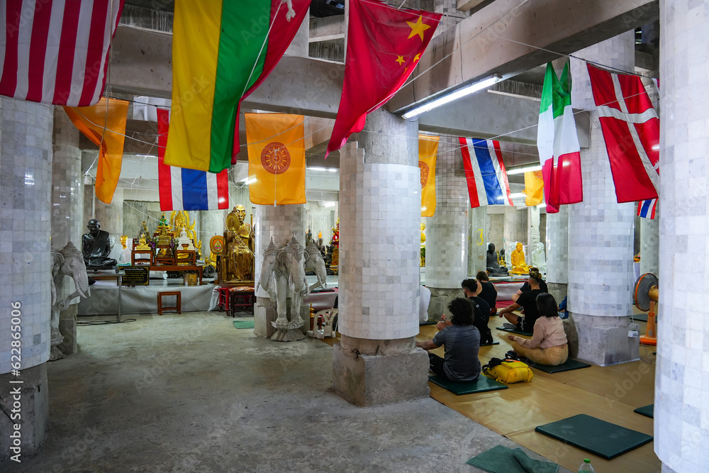 Interior of the Great Buddha of Phuket aka Ming Mongkol Buddha, is a seated Maravijaya Buddha statue made of concrete and covered in white Burmese marble tiles Interior of the Great Buddha of Phuket aka Ming Mongkol Buddha, is a seated Maravijaya Buddha statue made of concrete and covered in white Burmese marble tiles
