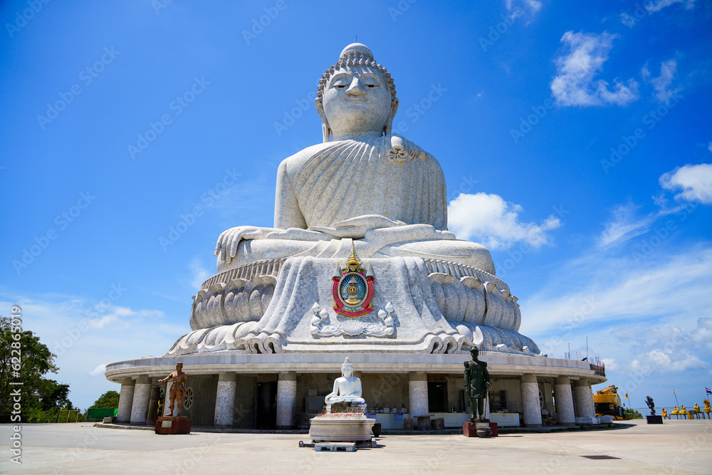 Fototapeta premium The Great Buddha of Phuket aka Ming Mongkol Buddha, is a seated Maravijaya Buddha statue made of concrete and covered in white Burmese marble tiles. It sits on top of a hill on Phuket island, Thailand