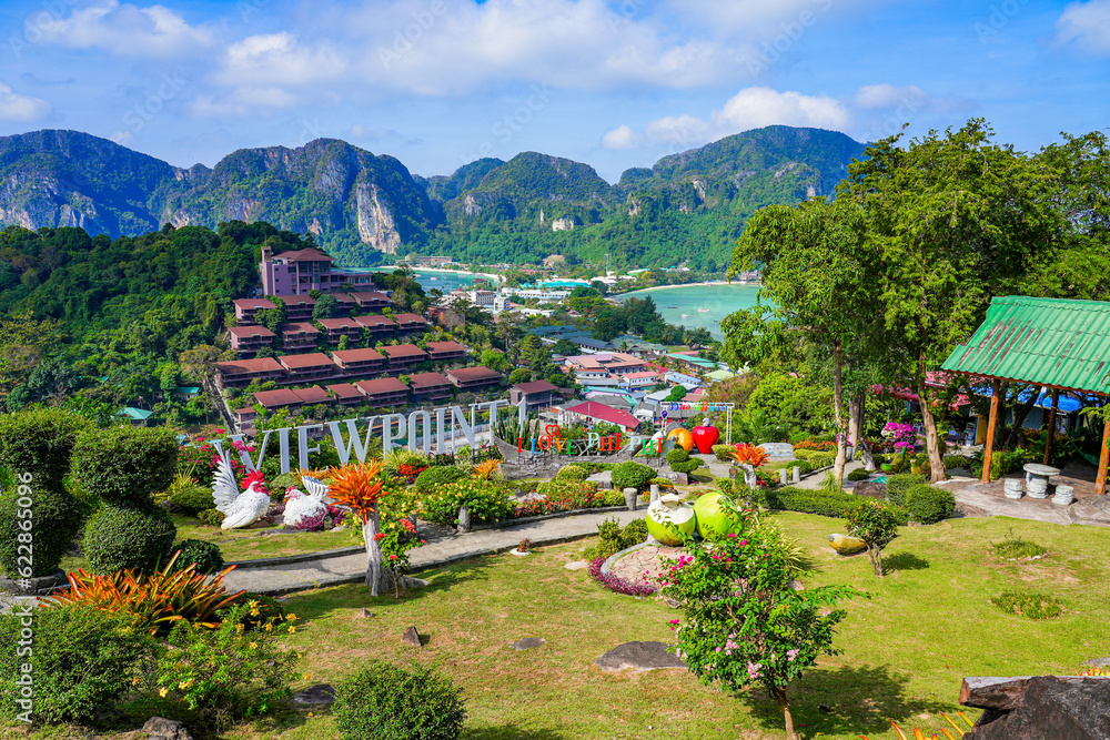 Colorful garden decorated with statues of fruits and animals on top of a hill towering above Koh Phi Phi island, Province of Krabi, Thailand