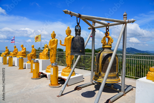 Sacred bell on the hilltop platform of the Great Buddha of Phuket overlooking Phuket island in Thailand photo