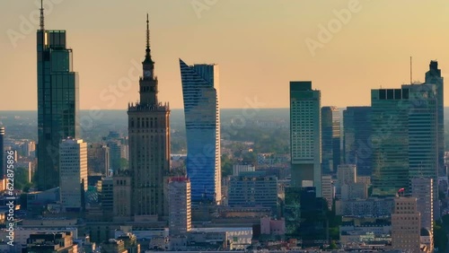 Aerial view of top of Palace of Culture and Science, Warsaw, Poland. Establishing aerial shot of Warsaw downtown. Warsaw Skyline Landmarks, capital of Poland. Swietokrzyski Suspension Bridge. 