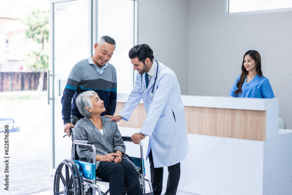 Mature doctor walking through the hallway to visit patient in hospital. Mature doctor walking through the hallway to visit patient in hospital.