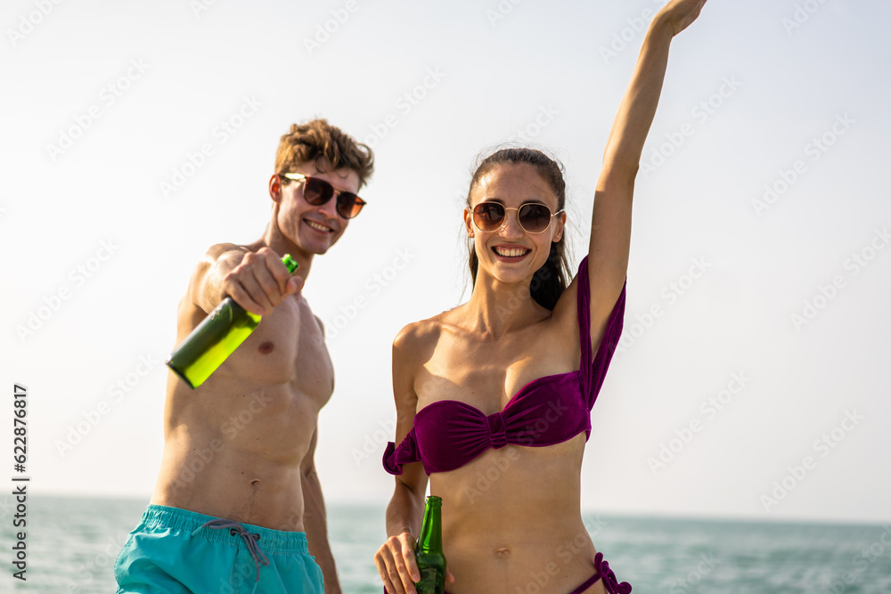 Caucasian young couple drinking champagne while having party in yacht. Caucasian young couple drinking champagne while having party in yacht.