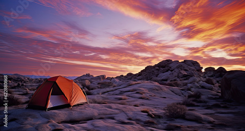  Illustration of a brightly colored illuminated tent in the mountains with great views of the rocky landscape. Camping is a great way to get closer to nature and enjoy a summer vacation.