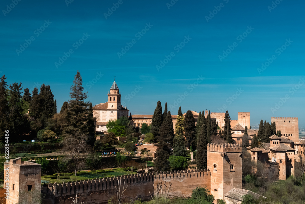 Granada,Spain. April 14, 2022: Alhambra castle panoramic landscape with blue sky.