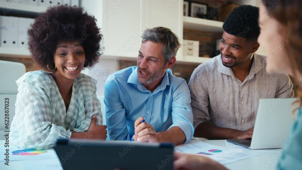 Group of male and female business people with laptop meeting in modern office - shot in slow motion Group of male and female business people with laptop meeting in modern office - shot in slow motion