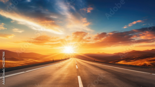 Empty long mountain road to the horizon on a sunny summer day at bright sunset © Sasint