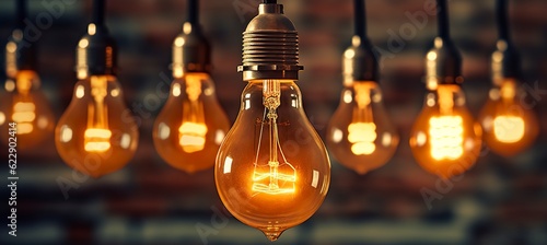 Decorative antique edison style light bulbs against brick wall background. vintage lamp decorative. AI Generative © MstAsma