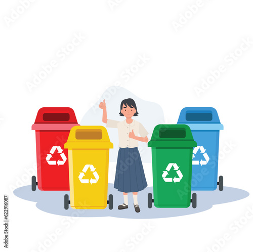 Kids with recycling garbage. girl is giving thumb up while explaining about the color of recycle bin.