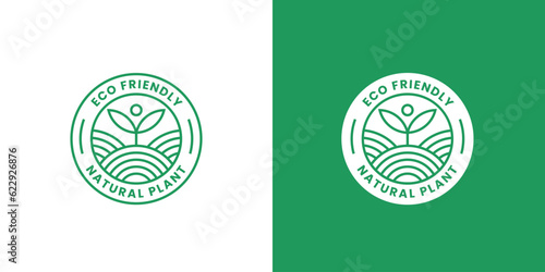 Eco friendly park logo design illustration. Silhouette garden plantation large land field grass plant tree shoots green simple minimalist circle shape label emblem sticker modern simple.