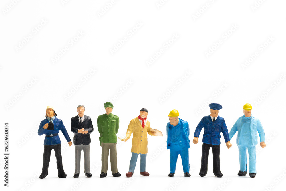 Miniature people different professions standing on white background and copy space for your text , Labour day concept Miniature people different professions standing on white background and copy space for your text , Labour day concept