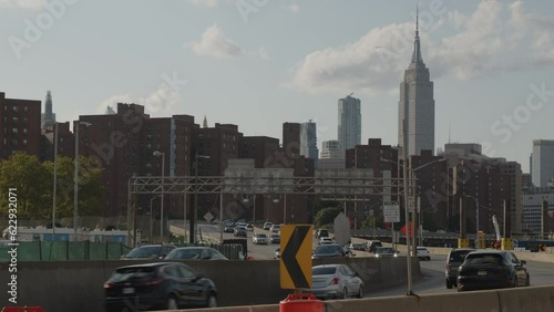 alt slow motion shot of traffic on FDR Drive with midtown NYC skyline in background photo