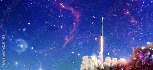 Fototapeta Naklejka Na Ścianę i Meble -  Shuttle launch in the clouds to outer space. Dark space with stars on background.Spaceship flight. Elements of this image furnished by NASA