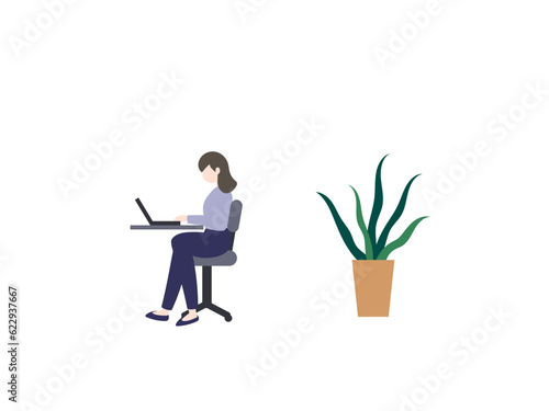 ノートパソコンを使う女性と観葉植物