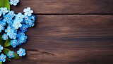blue flowers on wooden background, copy space