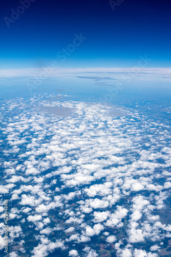Fototapeta Naklejka Na Ścianę i Meble -  View to a land and clouds from airplane